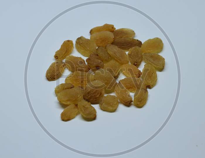 Yellow sultanas raisins isolated on white background
