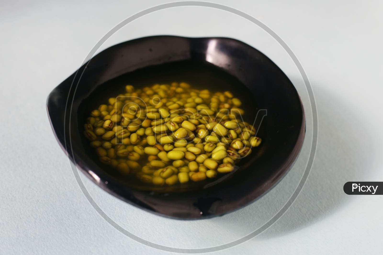 Green Bean Seeds Soaked In A Black Bowl