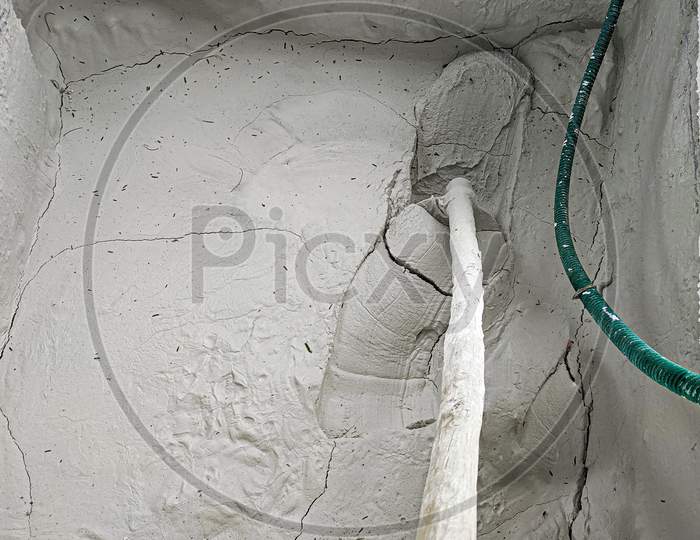 Top view of limestone paste in large quantity taking out with the help of iron Spade from the well.