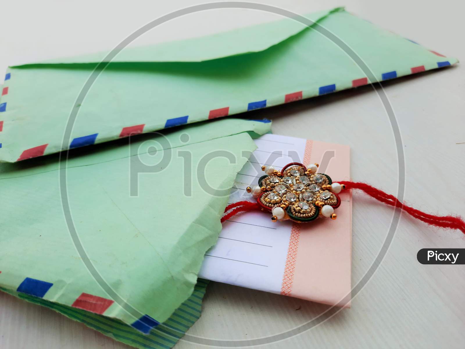 Closeup Of Rakhee Or Holy Thread With Message In Envelope On Raksha Bandhan