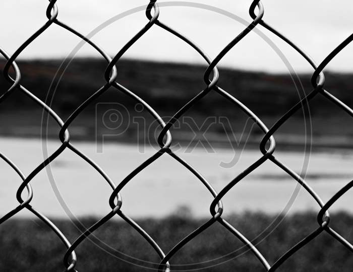 A black and white iron steel net cage
