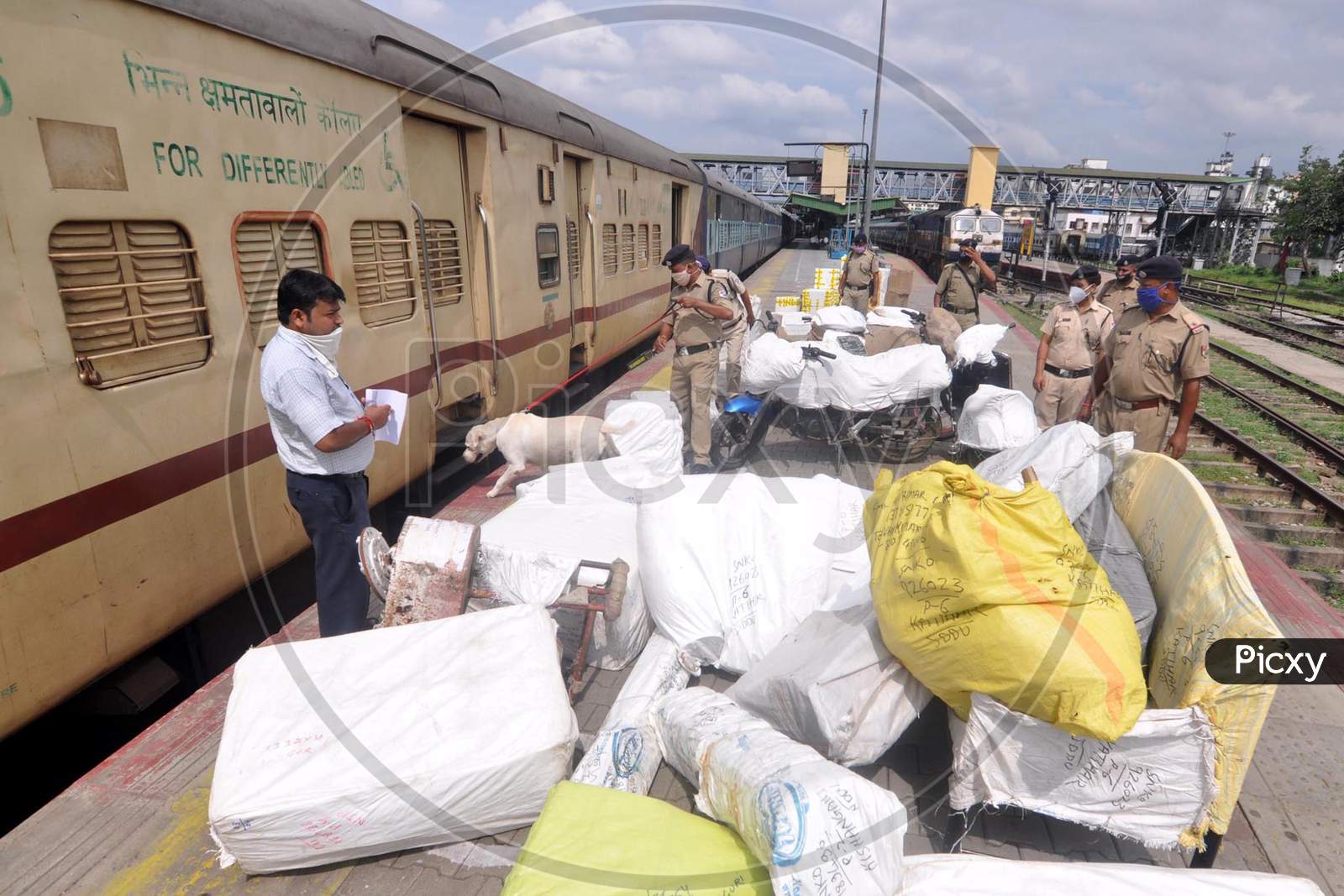 Railway Police Force (Rpf) Personnel Inspect Platform Along With A Sniffer Dog, Ahead Of The Independence Day Celebrations, In Guwahati On Monday, Aug 10, 2020.