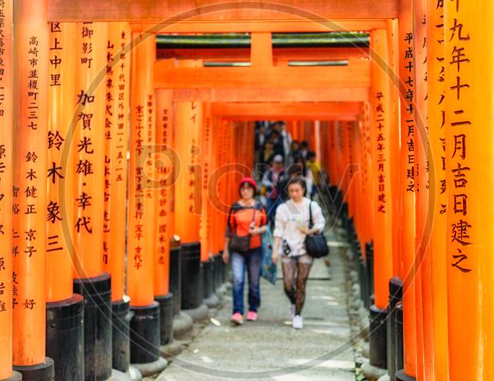 Famous Fushimi Inari Shinto Shrine With Its Red Torii Gates In Kyoto, Japan
