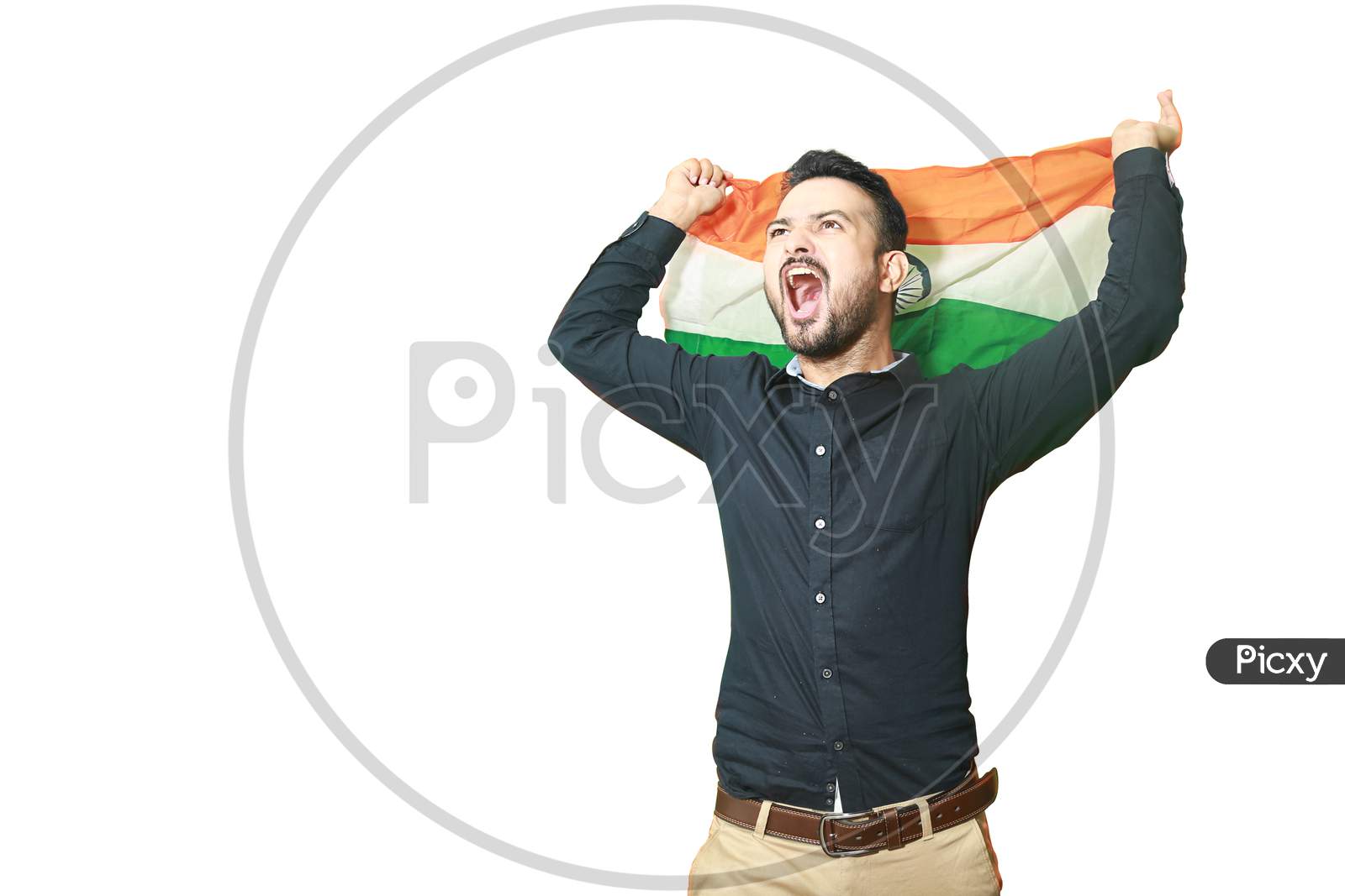Cheerful Handsome Young Indian Man Waving Indian Flag Screams With Excitement, Celebrating Republic Day Or Independence Day, Isolated On White Background Copy Space To Write Text.