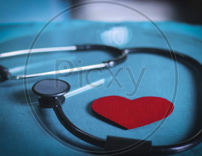 stethoscope on white background with red heart
