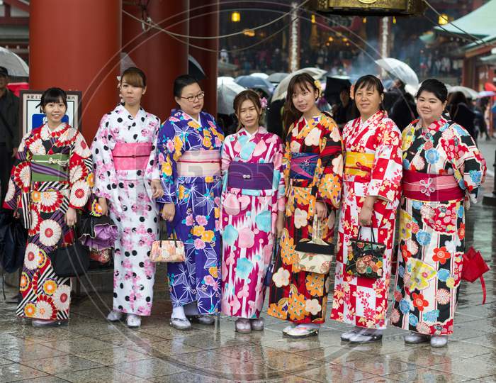 Girls Wearing Kimonos Outside Of The Sensoji Buddhist Temple In Asakusa, Tokyo