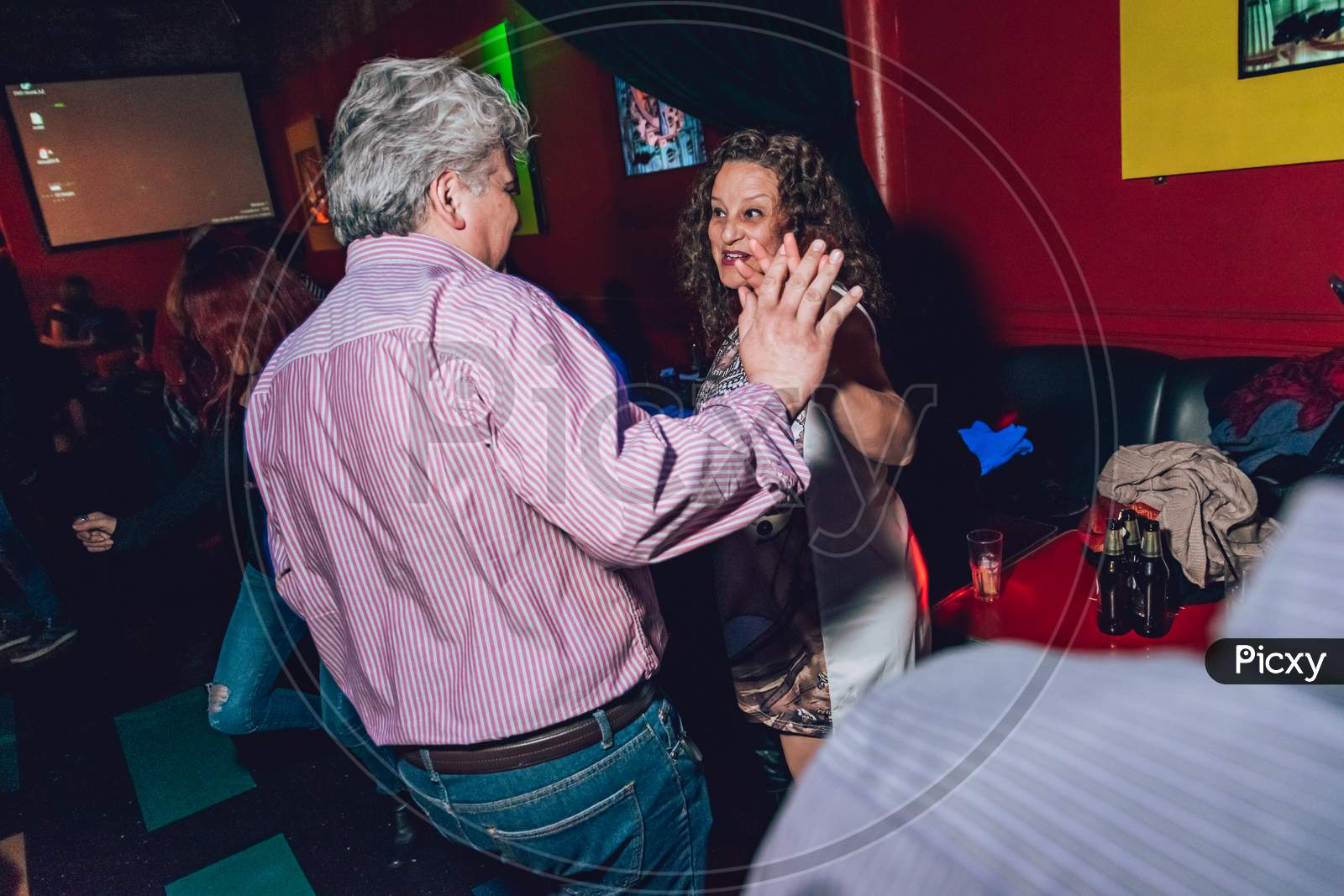 Adults Dancing In A Party.
