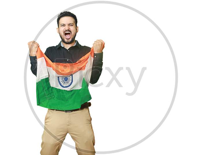 Cheerful Young Man Holding Indian Flag Screams With Excitement, Celebrating Republic Day Or Independence Day, Isolated On White Background Copy Space To Write Text.