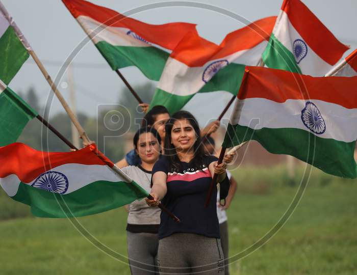 Girls hold the tricolor during rehearsals ahead of Independence Day at Jammu on August 10, 2020.