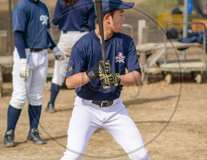 Japanese Baseball Players Practicing In Osaka, Japan