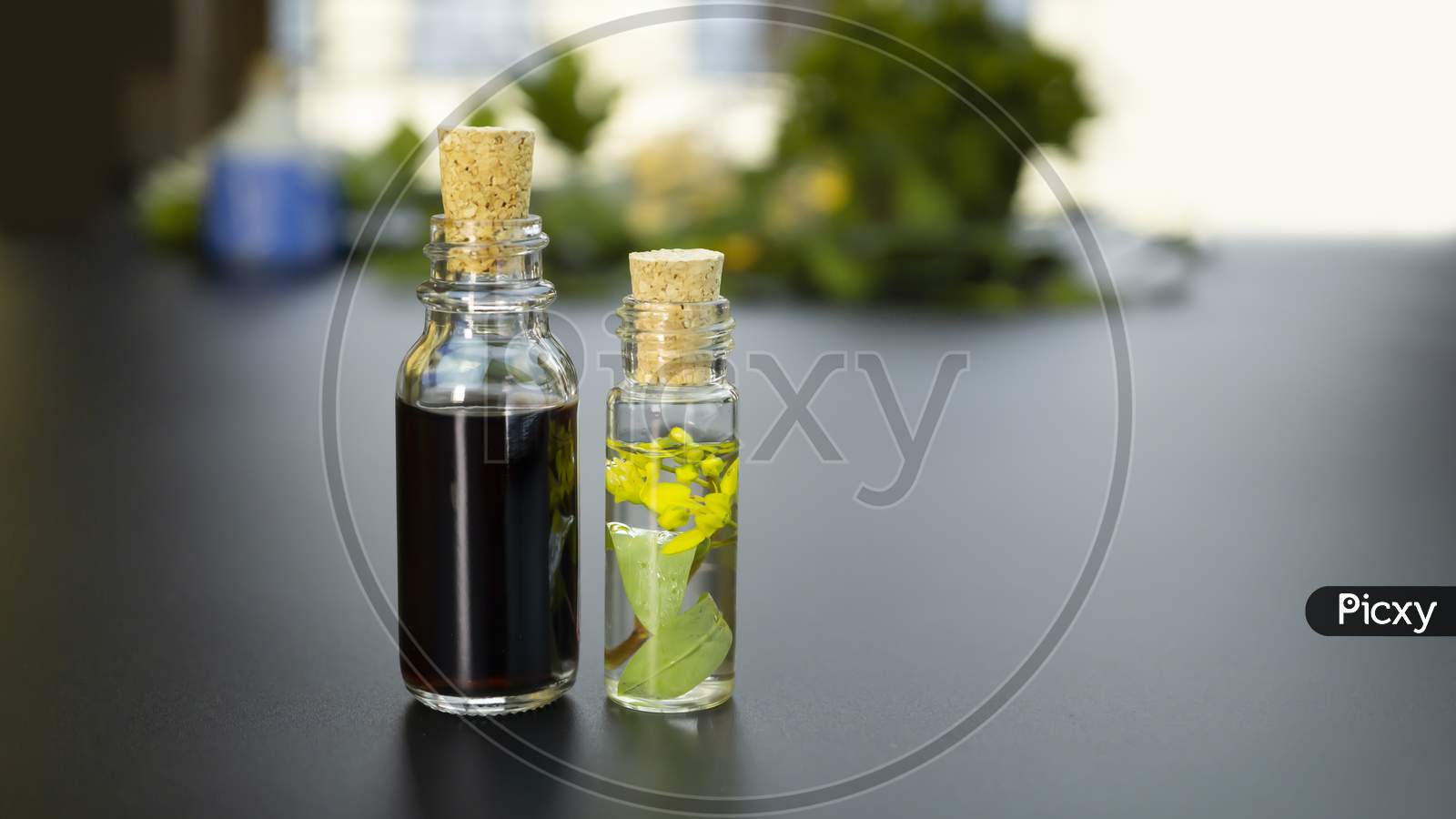 Clear Glass bottles of Aroma Therapy kept on the nice soft background as suggestion