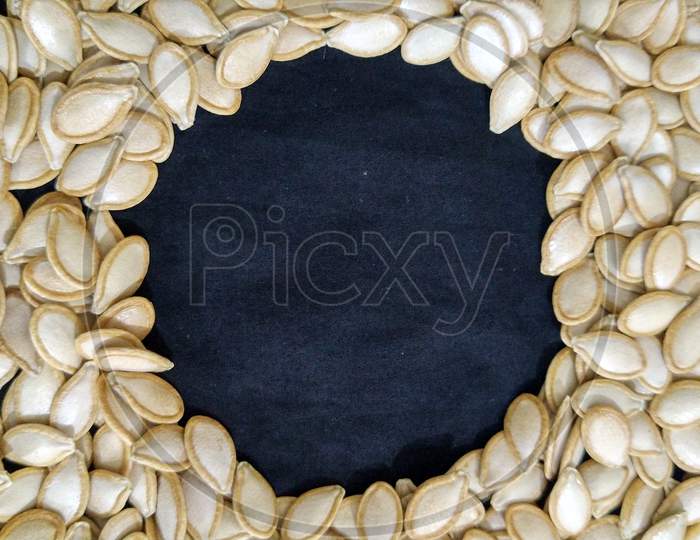 Beautiful pumpkin seeds with black background..