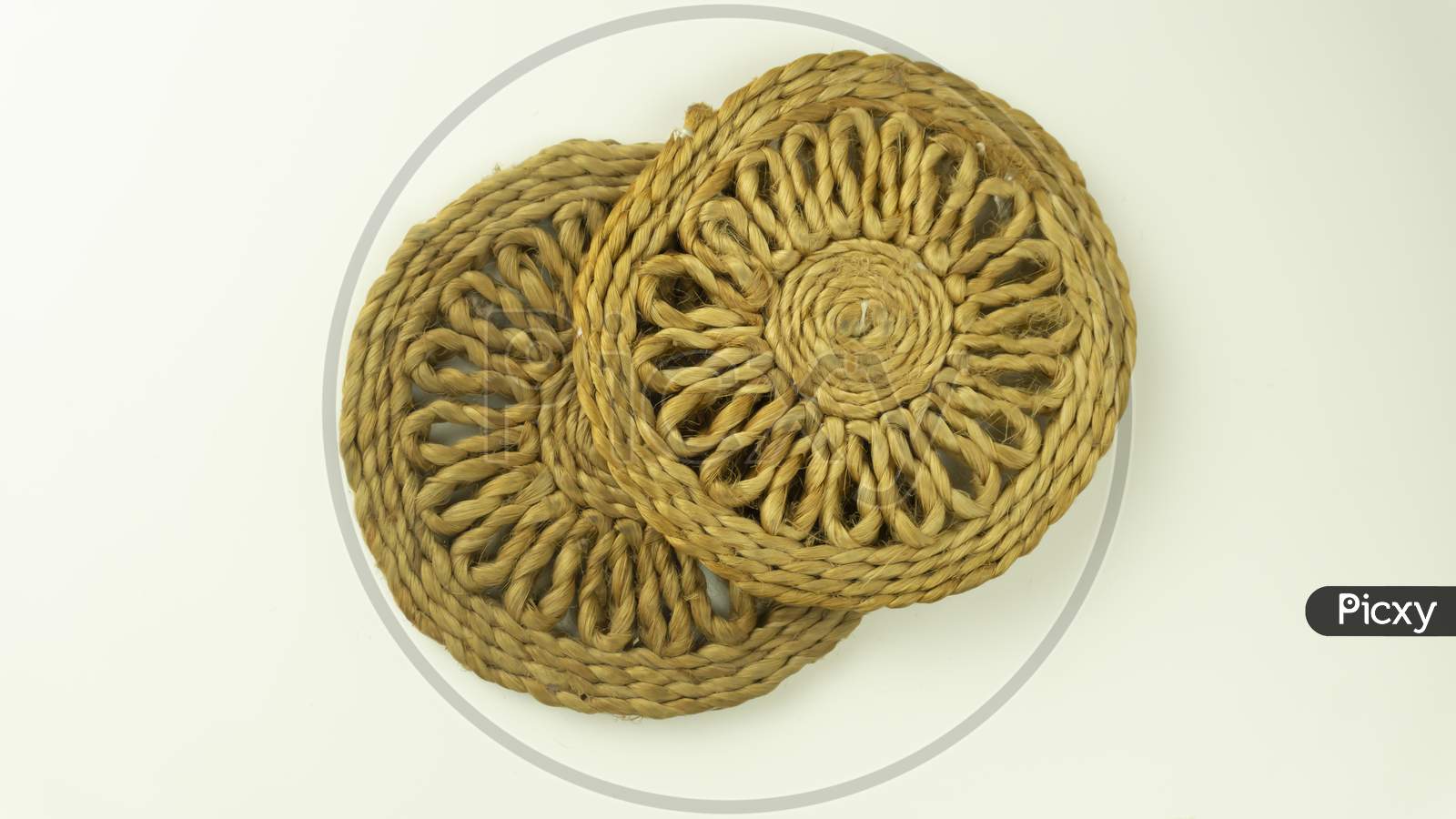 jute coaster kept one top of the other on isolated background
