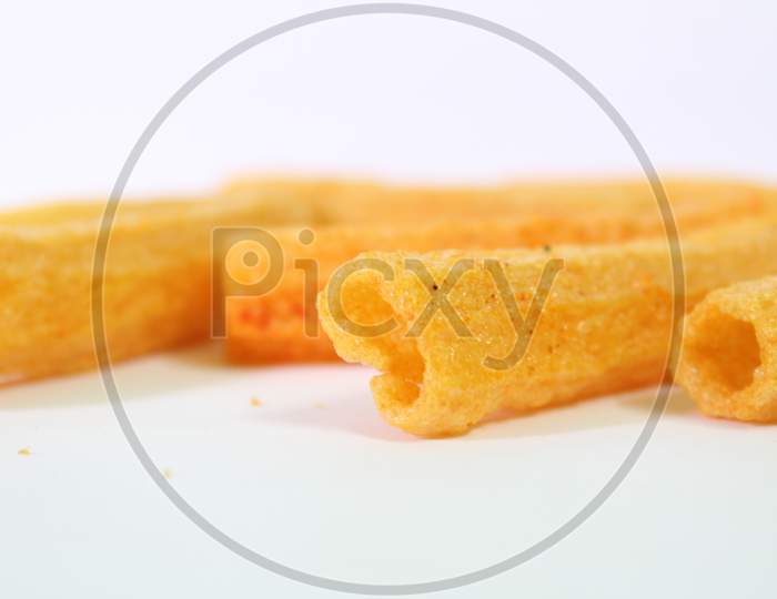 Closeup Shot Of Crispy Fried Roll Pappad Snacks With White Background