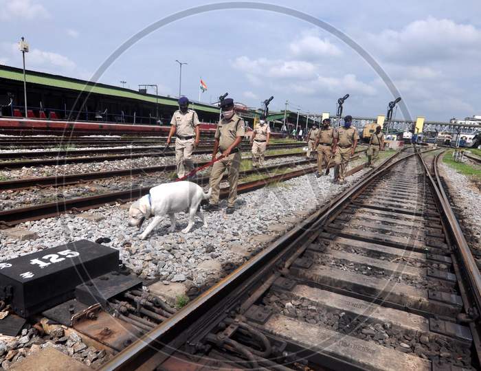 Railway Police Force (Rpf) Personnel Inspect The Tracks And Platform Along With A Sniffer Dog, Ahead Of The Independence Day Celebrations, In Guwahati On Monday, Aug 10, 2020