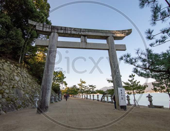 Entrance Torii Gate To The Itsukushima Shinto Shrine On The Miyajima Island