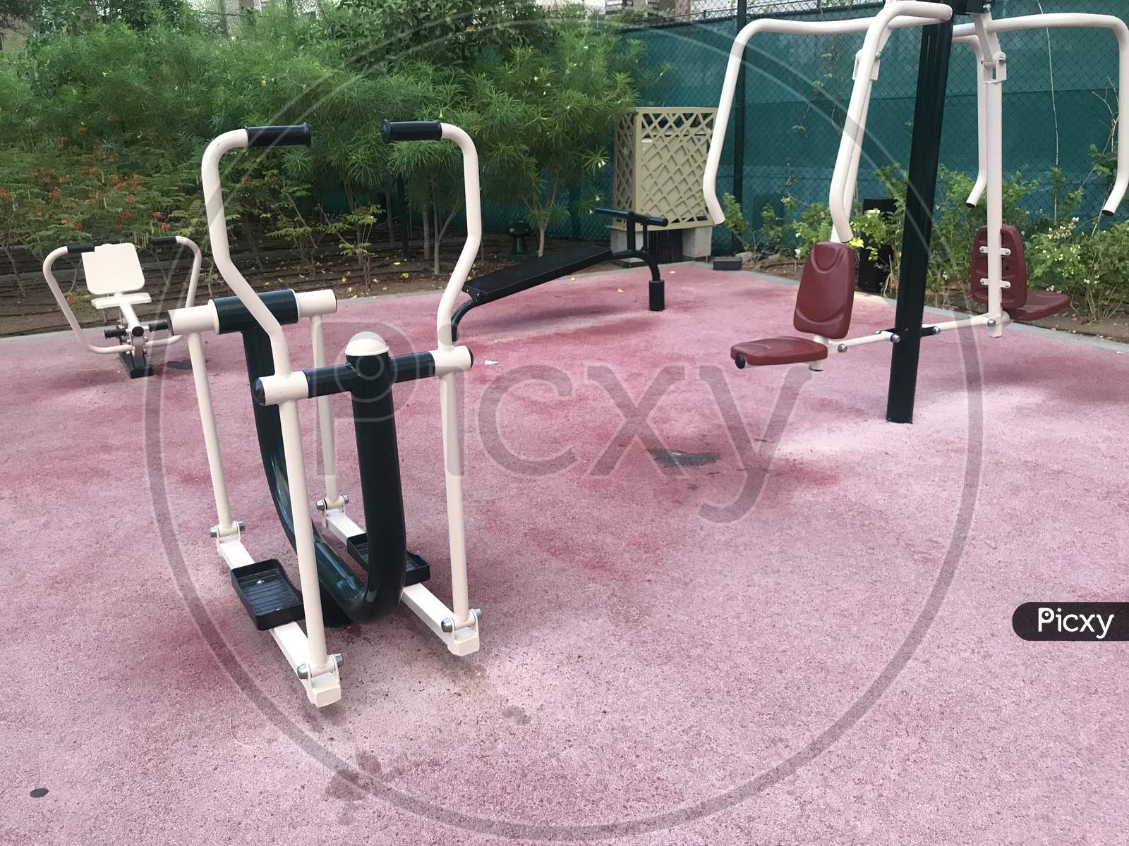 Manual Gym Equipment Fixed Around Rubber Flooring For Physical Workout And Exercise To Keep Healthy Body