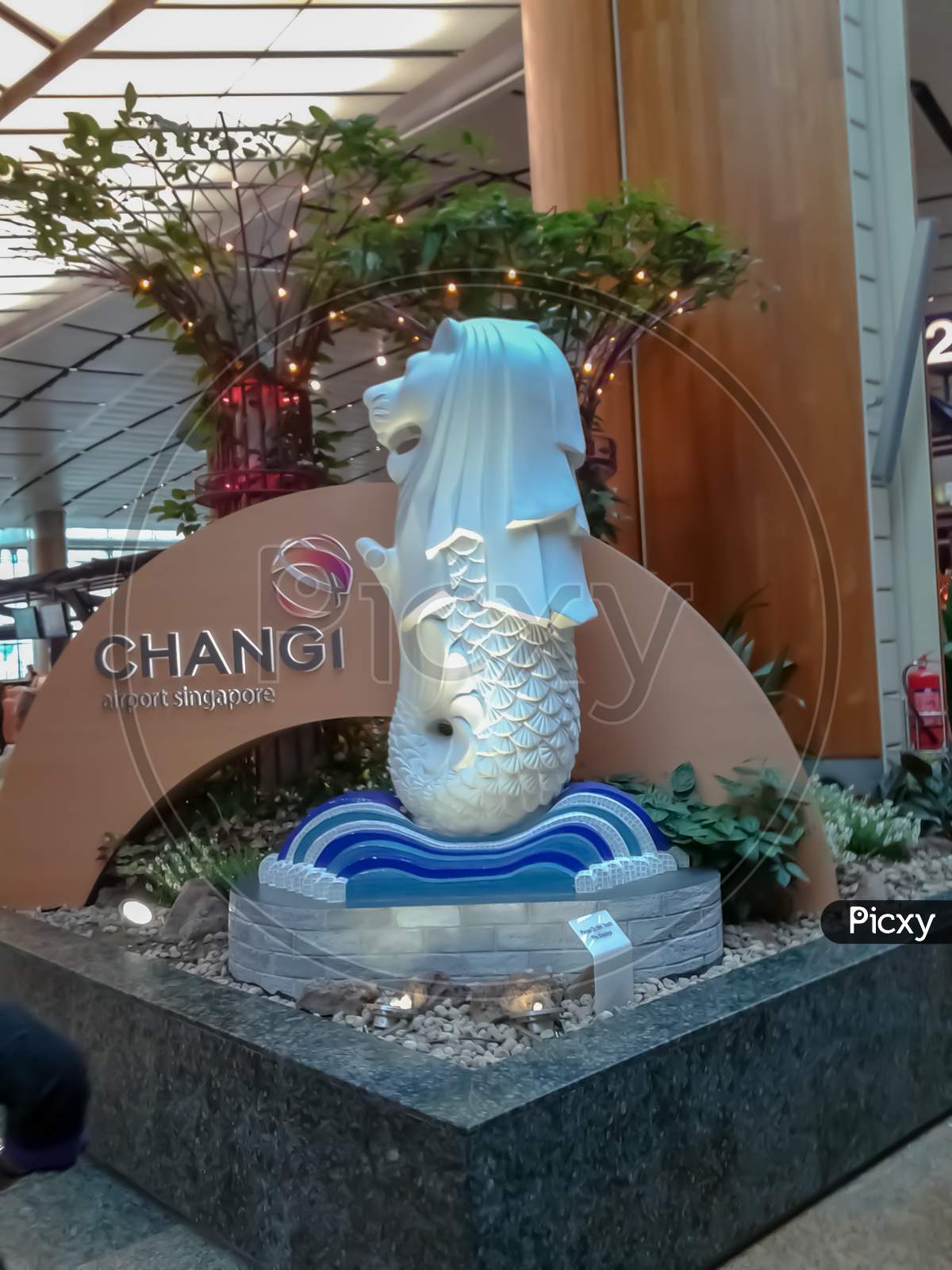22/2/2015, Singapore ,Singapore White Merlion In Singapore Changi Airport Terminal 2 Surrounded By Flowers And Plants