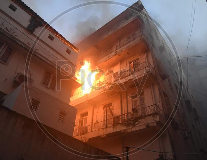 flames rise from a building after a massive fire broke out at multi storey building at pollock street in burrabazar area  on Monday 10th august 2020