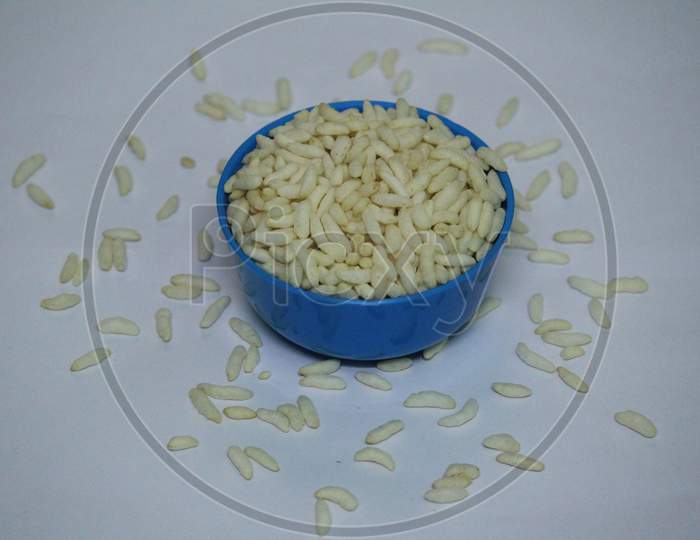 Puffed Rice On The Blue Bowl With White Background