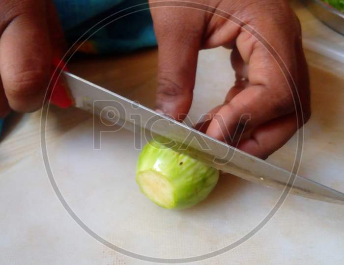 Picture Of Cutting Vegetables At Kitchen