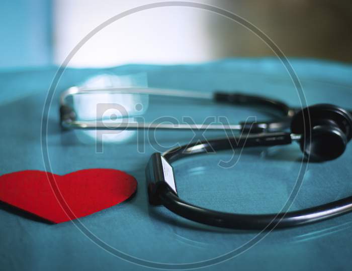stethoscope on white background with red heart