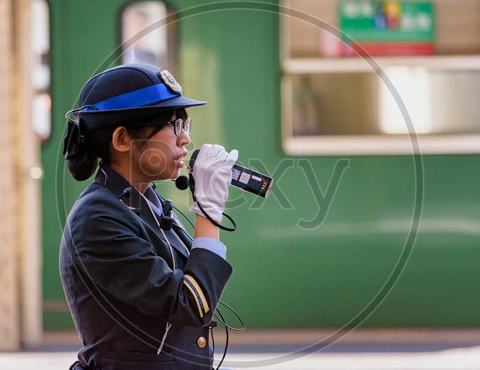 Female Train Station Officer In Kyoto Station, Kyoto, Japan