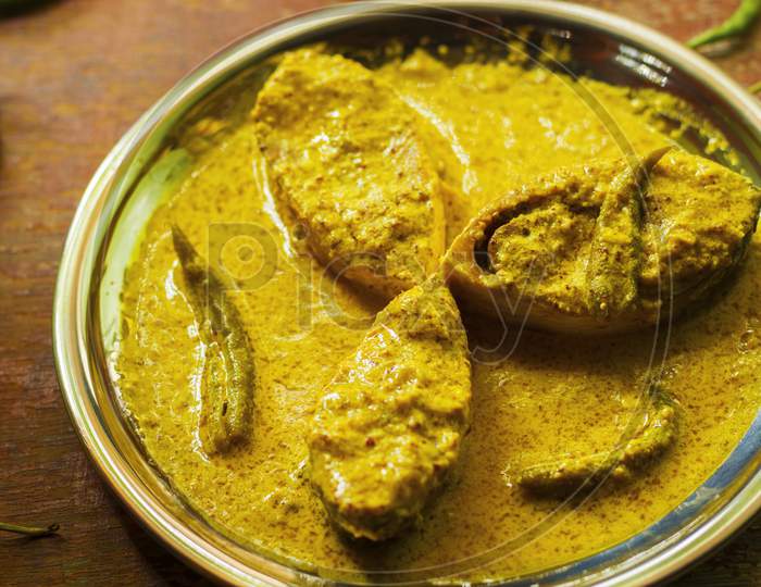 popular Bengali Illish/Hilsa fish curry with grinned mustard seed.