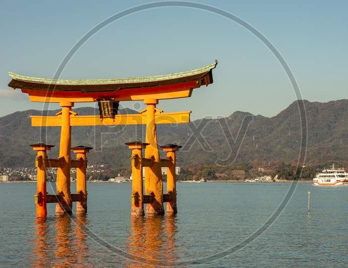 Itsukushima Shinto Shrine In Miyajima Island With Its Floating Torii Gate, Japan