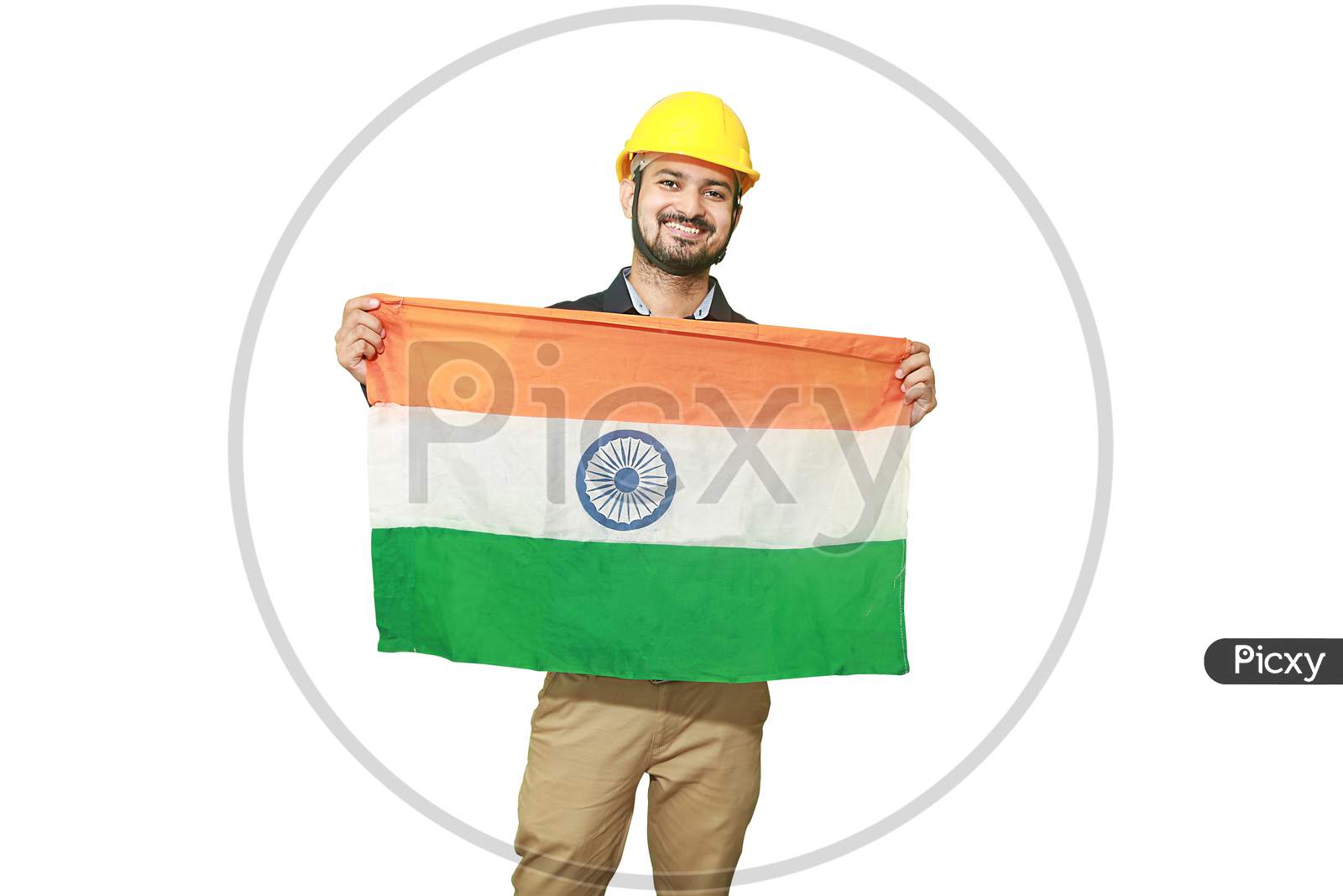 Happy Young Engineer Man Holding Indian National Tricolor Flag And Showing Patriotism, Republic Day Or Independence Day Concept Isolated On White Background
