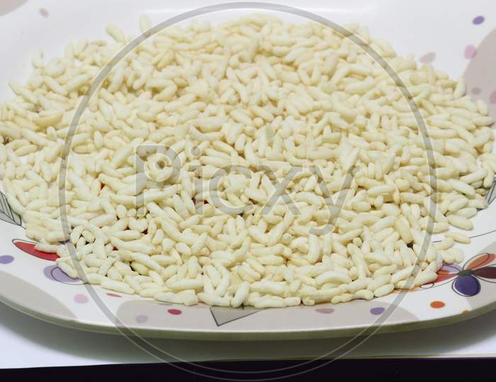 Puffed Rice On The White Designed Plate With White Background