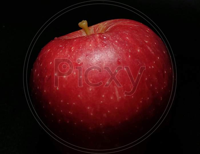 Red Apple on black background