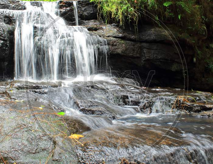 vattakanal waterfalls on levinge stream, located in a rain forest on the slope of palani mountain range at kodaikanal, tamilnadu, south india