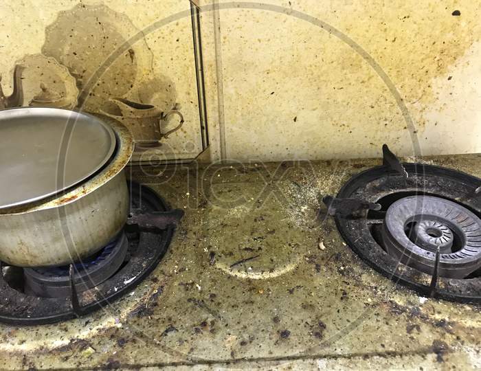 An Uncleaned Rusted Dirty Burned Stainless Steel Top Gas Stove In House Kitchen And Kitchen Clean Chemicals Can Clean This Rubbish To Make Clean And Tidy