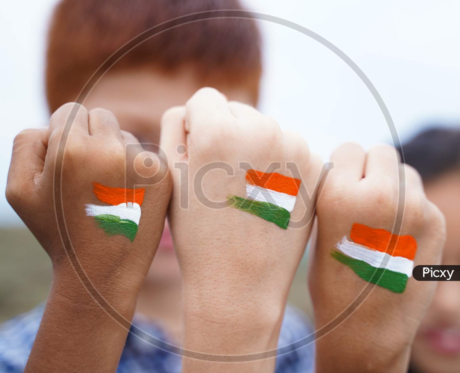 Kids Fist Hands Painted With Indian Falg During Independence Day Or Republic Day Celebration - Concept Showing Of Solidarity, Raised Fist Of A Protesters Or Patriotism