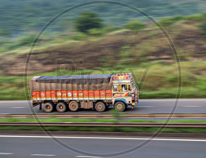 Motion Blur Image Of A Goods Truck Speeding On A Highway In Pune, Maharashtra, India.