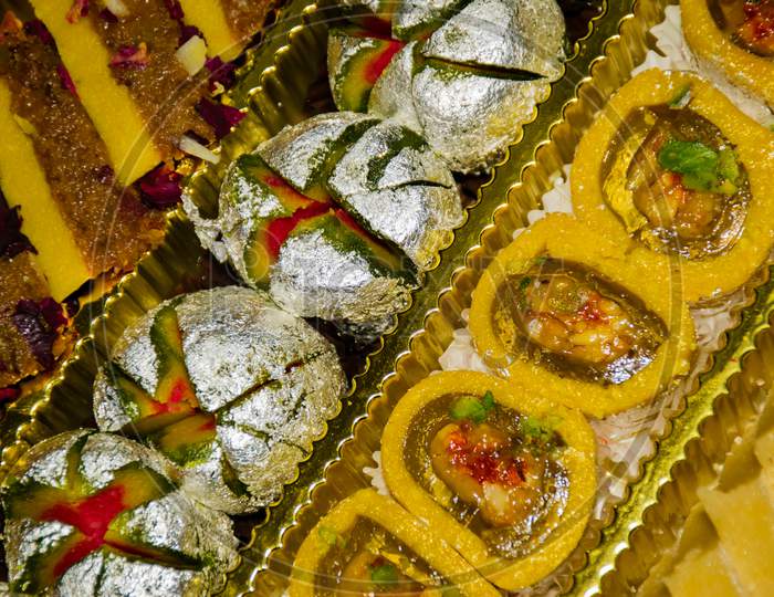 Close up Of A Box Full Of Colourful Indian Desserts For Diwali Festival