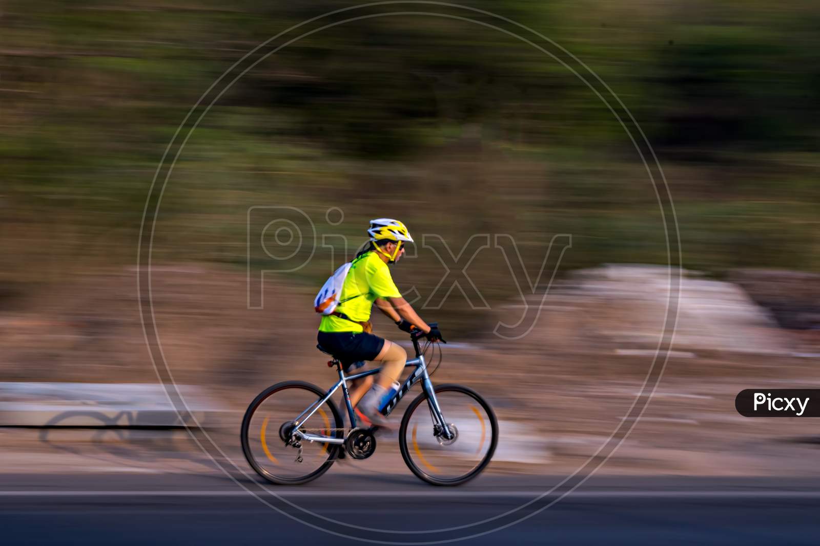 Pune, Maharashtra, India - October 4Th, 2017 : Motion Blur, Panning Image Of A Bicycle Rider Wearing Helmet For Safety.
