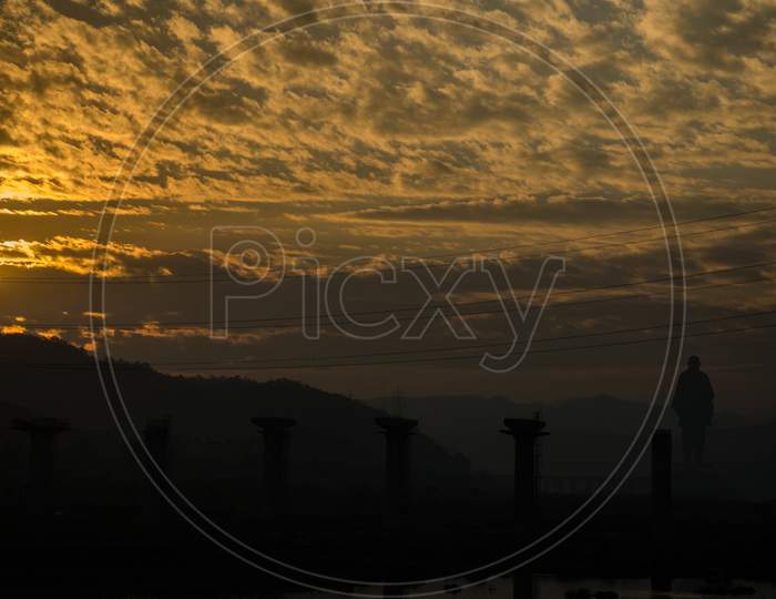 Panoramic View Of Sunrise With Silhouette Of Statue Of Unity In Gujarat, India