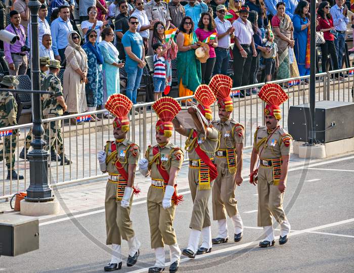 Amritsar,Punjab,India-April 14Th, 2019:Border Security Force Personnel Ceremoniuosly Taking Back The Lowered Indian National Flag After Beating Retreat Ceremony At The India-Pakistan Wagah Border.