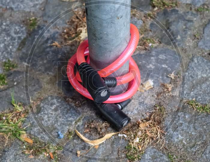 Abandoned Bike Lock Left At A Metallic Fence From A Stolen Bike