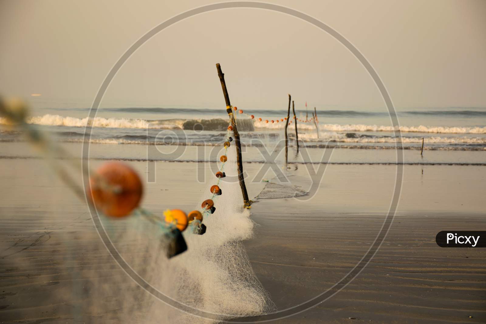Fishing Net Arranged With Coloured Rings On Nagaon Beach In India