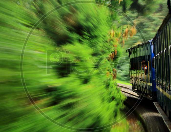 unesco world heritage nilgiri mountain rail or ooty toy train (nilgiri mountain railway) is going through the green forest at ooty in tamilnadu, south india