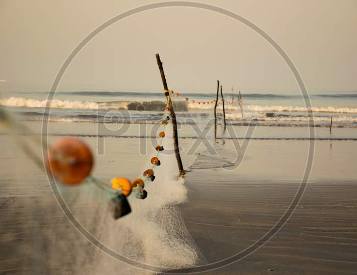 Fishing Net Arranged With Coloured Rings On Nagaon Beach In India