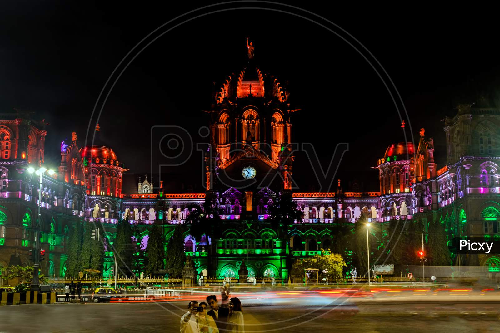 A Family Takes Selfie Against Unesco Heritage Building Of `Chatrapati Shivaji Maharaj Terminus` Railway Station Specially Lighted Like Indian Flag .