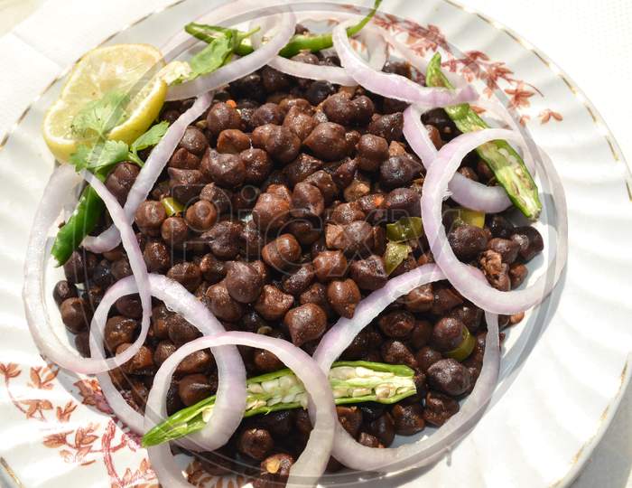 White Plate Full Of Indian Roasted Black Chickpeas