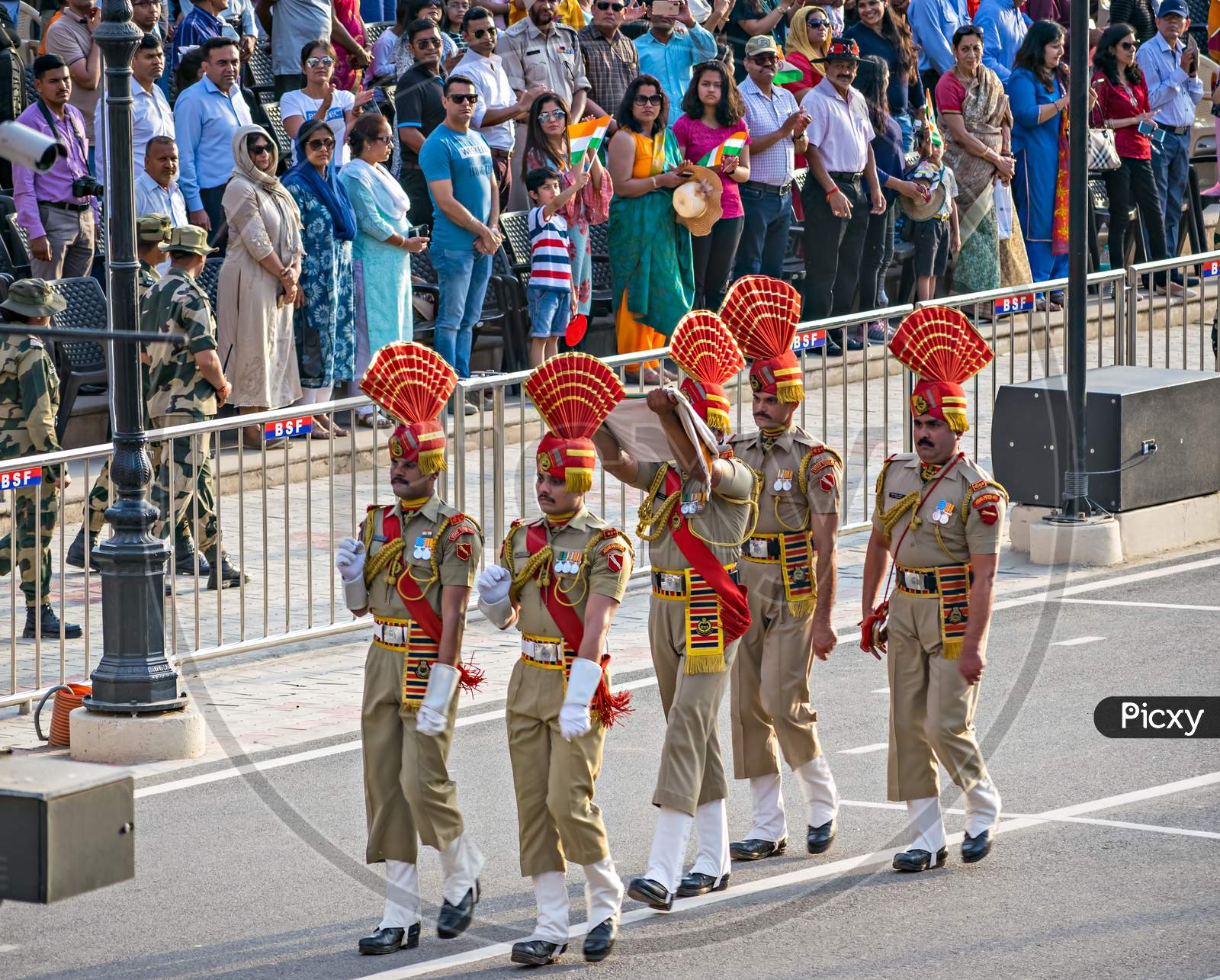 Amritsar,Punjab,India-April 14Th, 2019:Border Security Force Personnel Ceremoniuosly Taking Back The Lowered Indian National Flag After Beating Retreat Ceremony At The India-Pakistan Wagah Border.
