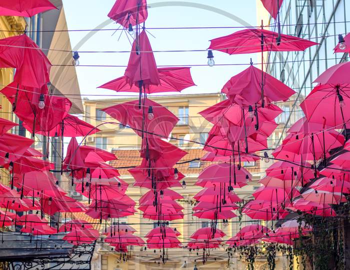 Red Umbrellas Above The Restaurant In Old Bohemian Part Of Belgrade Serbia