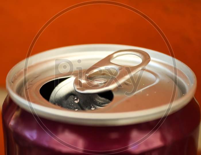 Close Up Top View Up A Can Of Soft Drink Isolated On Wooden Background