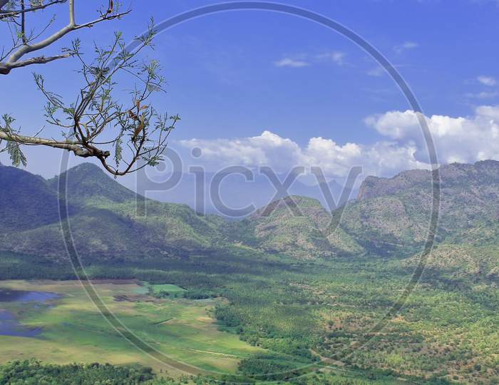 birds eye view of scenic palani foothills, green valley and manjalar dam, from a view point at kodaikanal in tamilnadu, south india